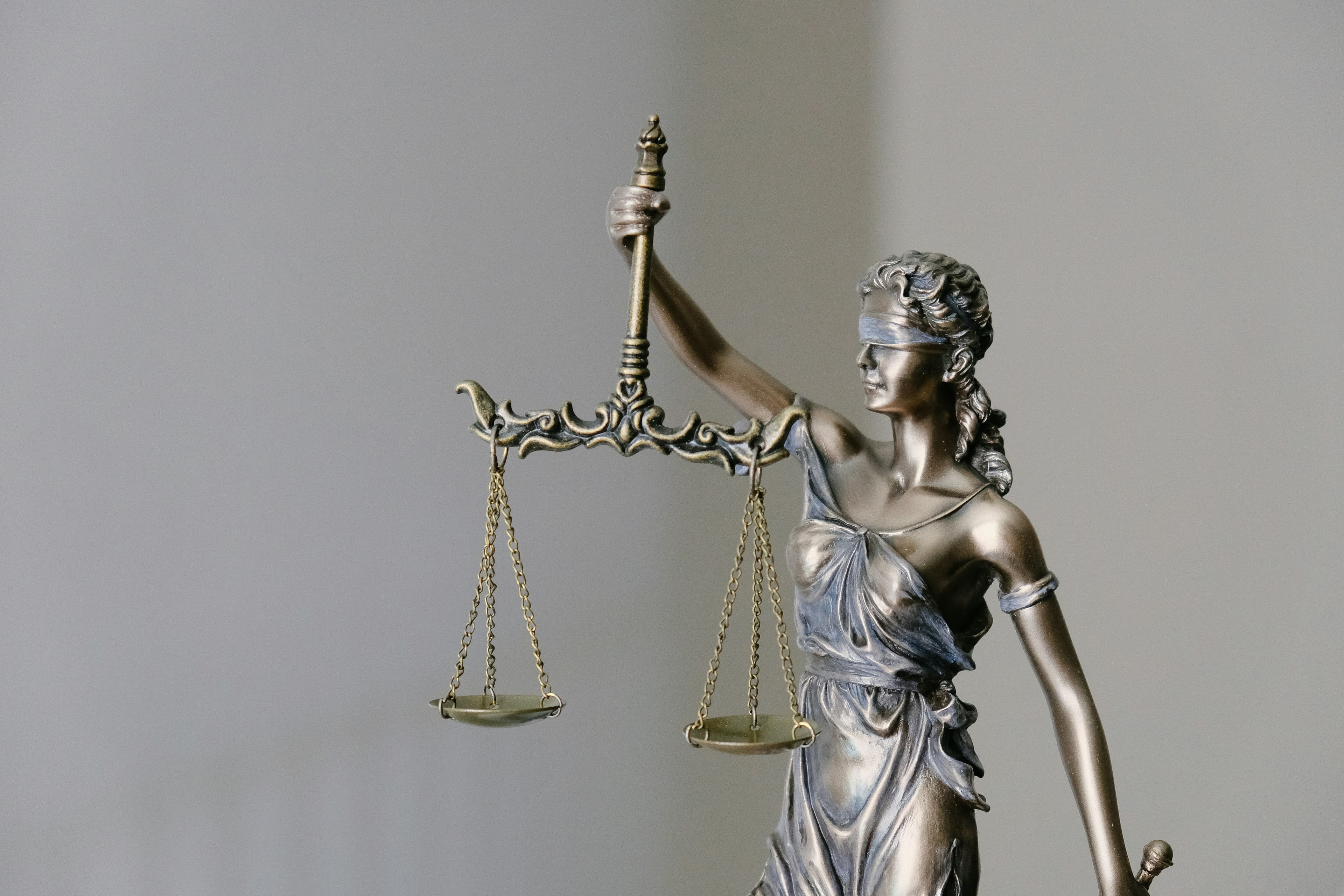 Courthouse and gavel illustration representing California regulatory enforcement action.
